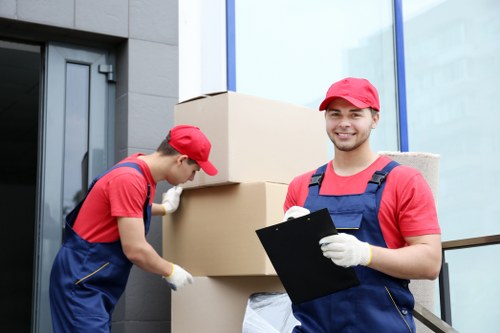 Packed boxes and furniture ready for same day collection in Battersea flat