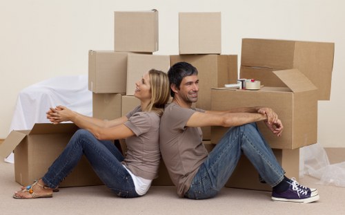 Loading household furniture into a removals van in Battersea