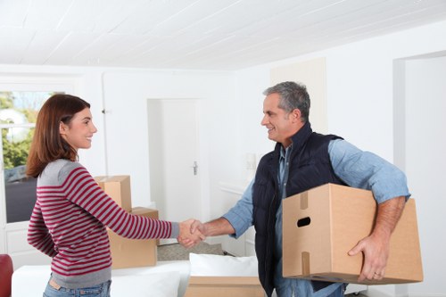 Local movers preparing boxes in Battersea near apartment access